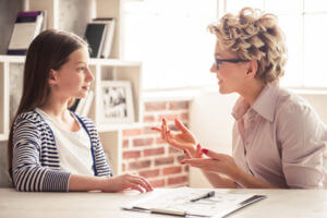 Local Professional Resources - teen girl with therapist